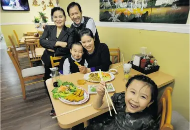  ?? MARK VAN MANEN/ PNG ?? The Cuu Long Vietnamese Restaurant is a family affair for the Trans. Clockwise , from top left, grandparen­ts Thao and Long and their daughter, Tien, are actively involved in the restaurant. Tien’s children, Tiffany and Nathan, enjoy the food.