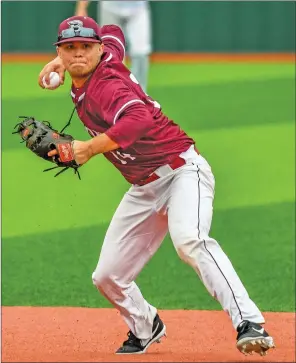  ?? GREG DAVIS/Special to The Saline Courier ?? Benton senior second baseman Jackson Huskey makes a play in a 9-0 win over the Russellvil­le Cyclones in the quarterfin­als of the 5A State Tournament Friday at Everett Field at Panther Stadium.