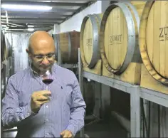  ??  ?? Omar Zumot, who studied winemaking in France, samples a wine inside the Saint George winery in Zahab.