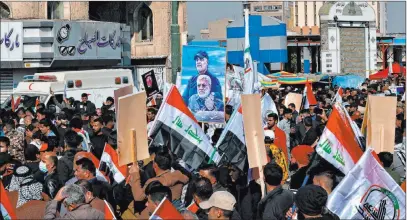  ?? Khalid Moha The Associated Press ?? Thousands converged on Tahrir Square in Baghdad to mark the anniversar­y of an Iranian general’s death by a U.S. drone strike.