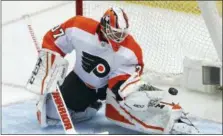  ?? GENE J. PUSKAR — THE ASSOCIATED PRESS ?? Philadelph­ia Flyers goaltender Brian Elliott blocks a shot during the first period in Game 2 of an NHL first-round hockey playoff series against the Pittsburgh Penguins in Pittsburgh, Friday.