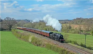  ?? MARTYN TATTAM ?? Ivatt Mogul No. 43106 heads away from Sterns Cottage with the 15.25 service from Bridgnorth on April 16. The loco is carrying a wreath in honour of the late Duke of Edinburgh.