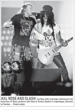  ?? — Reuters photo ?? Axl Rose (left), lead singer of American rock band Guns N’ Roses, performs with Slash at Parken Stadium in Copenhagen, Denmark on Tuesday.