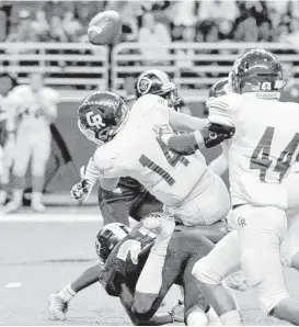  ?? Craig Moseley ?? Cinco Ranch’s Brant Kuithe (14) fumbles on a kickoff return in the first half to set up a short touchdown drive for Cibolo Steele on Saturday at the Alamodome.