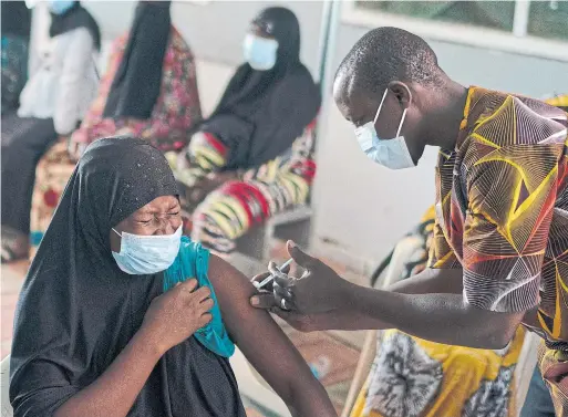  ?? LEO CORREA PHOTOS THE ASSOCIATED PRESS ?? Although data on gender breakdown of vaccine distributi­on are lacking globally, women in Africa’s poorest countries are consistent­ly missing out on vaccines.