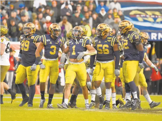  ?? PAUL W. GILLESPIE/CAPITAL GAZETTE PHOTOS ?? Navy's Jacob Springer celebrates a sack in the second quarter of the 120th Army-Navy Game at Lincoln Financial Field in Philadelph­ia.