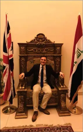  ??  ?? „ The MP tries out the Saddam Hussein throne at the UK embassy in Baghdad.
