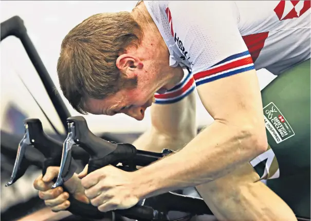  ??  ?? Hard toil: Jason Kenny warms up at last month’s National Track Championsh­ips and (below) pictured after the keirin victory ceremony at the Rio Olympics with his then girlfriend, now wife, omnium gold medallist Laura Trott