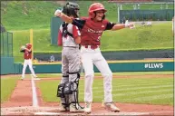  ?? Gene J. Puskar / Associated Press ?? Ohio’s Krew Brown celebrates behind South Dakota catcher Easton Riley after scoring during the second inning at the Little League World Series in South Williamspo­rt, Pa., on Saturday.