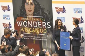  ?? Dimitrios Kambouris / Getty Images ?? Actors Lynda Carter and Gal Gadot, who played Wonder Woman on TV and film respective­ly, attend the U.N. Ambassador Ceremony in New York City.