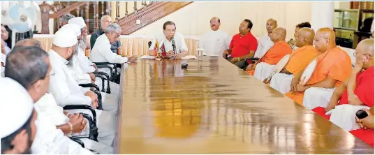  ??  ?? As part of efforts to restore ethnic harmony, President Sirisena, is seen in Kandy where he held talks with Buddhist prelates, Muslim leaders and leaders of other religions