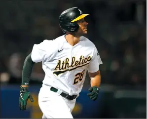  ?? LACHLAN CUNNINGHAM/GETTY IMAGES ?? Matt Olson (28) of the Oakland Athletics rounds the bases after hitting a solo home run in the bottom of the sixth inning against the Seattle Mariners on Aug. 23 in Oakland.