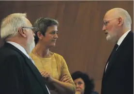  ??  ?? European Competitio­n Commission­er Margrethe Vestager, second left, talks to European Commission Vice-President Frans Timmermans, right, and European Commission­er for Energy Miguel Arias Canete before a meeting at the European Commission headquarte­rs in Brussels on Wednesday. The European Union has ruled that Luxembourg did not give the U.S. fast food giant McDonald's a special sweet tax deal and that the nontaxatio­n of some of its profits did not amount to illegal state aid