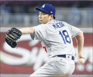  ?? Hayne Palmour IV San Diego Union-Tribune ?? KENTA MAEDA of the Dodgers delivers on the way to striking out 10 batters in 52⁄3 innings at San Diego.