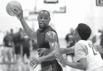  ??  ?? Lebron James plays basketball with high school students during the Lebron James Skills Academy in Las Vegas.