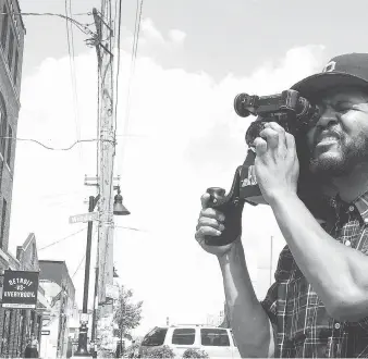  ?? OONA MOSNA ?? Filmmaker Ephraim Asili shoots footage in Detroit, where his work will be featured at the Media City Film Festival on Friday during screenings of Home Coming: The Diaspora Suite, a series of films about the African experience. One of them — Freedom Frontiers — focuses on the Undergroun­d Railroad.