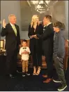  ?? Courtesy photo ?? Mike Garcia, second from right, is sworn into office Tuesday. He is joined by his family in the office of U.S. Rep. Kevin McCarthy, R-Bakersfiel­d, left.