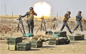  ??  ?? Iraqi forces fire mortars on Thursday against Kurdish Peshmerga positions near an area located on the Turkish and Syrian borders in the Iraqi Kurdish autonomous region. (AFP)