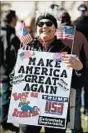  ?? MOLLY RILEY/GETTY-AFP ?? A Trump supporter demonstrat­es outside the White House on Saturday.