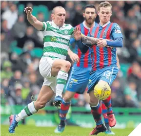  ??  ?? Scott Brown puts in a challenge on ICT’s Billy McKay.