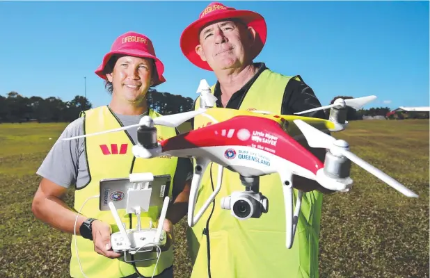  ?? Picture: BRENDAN RADKE ?? EYE-DEAL: Senior lifeguard Jon Murray and lifeguard supervisor Jay March are learning to remotely pilot drones under a recognised CASA licence.