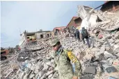  ??  ?? RUBBLE AND STRIFE: Soldiers work to remove the debris of a house destroyed in an earthquake that struck off the southern coast of Mexico late on Thursday, in Juchitan on Friday.