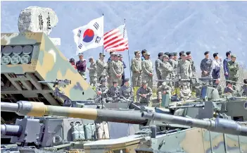  ?? — AFP file photo ?? South Korean and US soldiers watch from an observatio­n post during a joint live firing drill between South Korea and the US at the Seungjin Fire Training Field in Pocheon, 65kms northeast of Seoul.