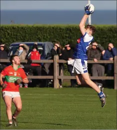  ??  ?? Fine fielding was on display in Dunbur Park on Sunday.