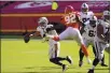  ?? CHARLIE RIEDEL — THE ASSOCIATED PRESS ?? Las Vegas Raiders quarterbac­k Derek Carr (4) runs from Kansas City Chiefs defensive end Tanoh Kpassagnon (92) during the second half Sunday in Kansas City, Mo.