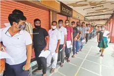  ?? PTI ?? ■ Aspirants stand in a queue before appearing for Rajasthan Eligibilit­y Test for Teachers in Jaipur.