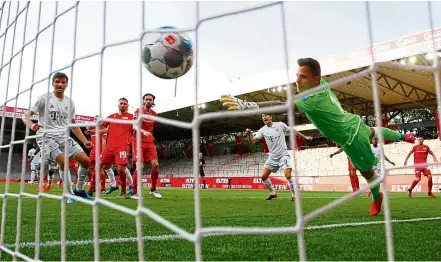  ??  ?? Back of the net: Benjamin Pavard (hidden) scores Bayern Munich’s second goal against Union Berlin on Sunday. — Reuters