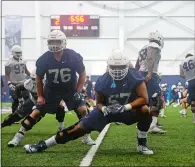  ?? SARAH GORDON/THE DAY ?? UConn offensive lineman Brian Cespedes, right, on the first day of practice this fall, has a chance to start for the Huskies as long as he continues to work hard. Cespedes said he took some advice from a couple former teammates - “you’re not a kid anymore” - to heart, resulting in a more mature outlook for the redshirt junior.
