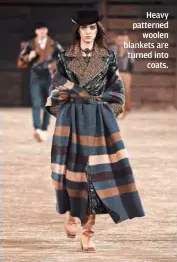  ?? Heavy patterned
woolen blankets are turned into
coats. ??