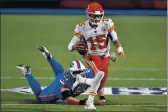  ?? ADRIAN KRAUS — THE ASSOCIATED PRESS ?? Chiefs quarterbac­k Patrick Mahomes evades the Bills’ Justin Zimmer during the second half on Monday.