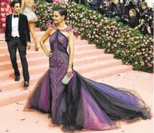  ?? Karsten Moran / New York Times ?? Actress Katie Holmes wears a Zac Posen gown at a Metropolit­an Museum of Art benefit gala in May.