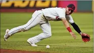  ?? TONY DEJAK — THE ASSOCIATED PRESS ?? The Indians’ Andres Gimenez tries to field a single hit by the Rangers’ Jose Trevino during the eighth inning Aug. 26 at Progressiv­e Field.