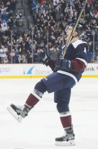  ??  ?? Avalanche defenseman Tyson Barrie celebrates his go- ahead goal in the third period of Colorado’s 5- 3 win over Nashville on Friday night at the Pepsi Center. Andy Cross, The Denver Post