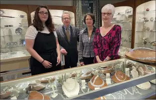  ?? ?? Standing by a showcase sparkling with jewelry, Michael Cook, owner of Walter J. Cook Jeweler in Paoli, is surrounded by some of the shop’Äôs staff, left to right, Ashley Agatone, Vivien Hoke, and Susan Kefford.