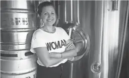  ??  ?? Megan Greenwood, the brewmaster for Greenwood Brewing, stands next to her kegs on Oct. 18, 2019, in Peoria.