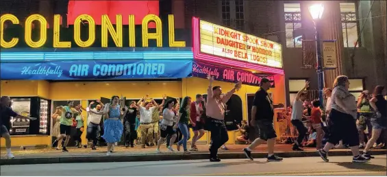  ?? MEDIANEWS GROUP FILE PHOTO ?? Phoenixvil­le’s Colonial Theatre needs to raise $150,000 to meet its financial obligation­s, and has launched a GoFundMe campaign to help raise a portion of the funds needed. This file photo show theatre-goers running out of the Colonial Theatre to avoid the blob as part of the annual “Blobfest” celebratio­n in Phoenixvil­le in 2019. The patrons reenact a famous scene from the 1950s horror classic “The Blob.” This year’s Blobfest was held virtually.