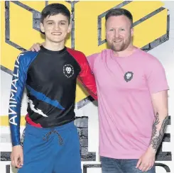  ??  ?? Entreprene­ur Tony with kickboxer Jamie Mcgowan wearing Animalia Apparel Picture by Lee Mcadam