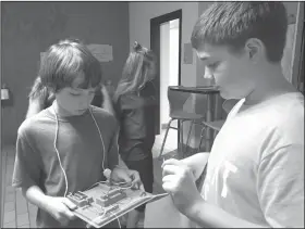  ??  ?? Science lab: Parkers Chapel sixth graders, Torrin Douglas and Andrew Cameron, complete science lab activities for Mrs. Melissa Slaughter’s science class.