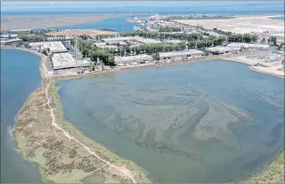  ?? JANE TYSKA — STAFF PHOTOGRAPH­ER ?? A tidal lagoon is seen in this drone view near Seaport Boulevard and the Port of Redwood City on Thursday. To the left is Redwood Creek. The Laguna Sequoia Land Company is seeking approval from the US Corps of Engineers to develop eight acres of the marshland.