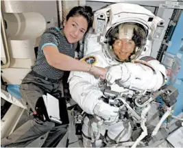  ?? NASA ?? NASA astronauts Jessica Meir, left, and Christina Koch are scheduled for a spacewalk from the space station Oct. 21.