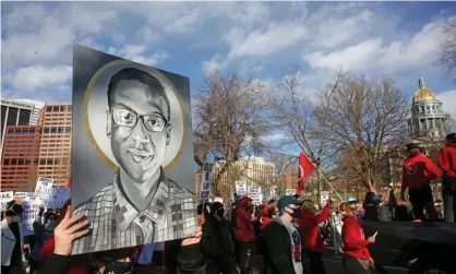  ?? Photograph: Kevin Mohatt/Reuters ?? Protesters march to call for justice for Elijah McClain in November 2000. Hi mother said her son wanted to change the world, ‘And it’s crazy, because he ended up doing it anyway.’