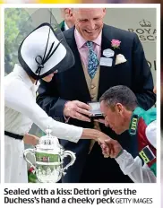  ?? GETTY IMAGES ?? Sealed with a kiss: Dettori gives the Duchess’s hand a cheeky peck