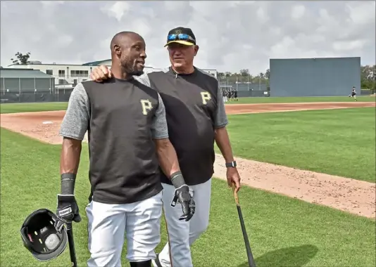  ?? Matt Freed/Post-Gazette ?? Starling Marte, left, was once uncomforta­ble acting as a leader, but has become one of manager Clint Hurdle’s best on and off the field.