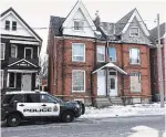  ?? JOHN RENNISON THE HAMILTON SPECTATOR ?? A police cruiser sits outside a house on Wellington North. Police are investigat­ing a report that a baby is buried at a residence on the street.