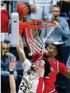  ??  ?? Liddell blocks a shot by Michigan forward Brandon Johns Jr. during Saturday’s win. Liddell scored 18 points and the Buckeyes held the Wolverines to 35% shooting.