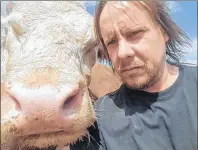  ?? CP PHOTO ?? Farmer Melvin Burns is shown in a handout photo. Burns, the owner of a free-range animal farm in Nova Scotia, has taken the unusual step of offering bacon as an incentive for informatio­n about two major thefts from his property this summer.